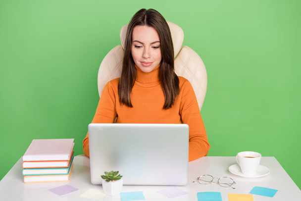 Portrait of attractive focused skilled girl agent broker working remotely chatting with client isolated over bright green color background - Фото, изображение