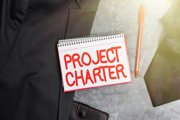 Hand writing sign Project Charter. Concept meaning typically short formal document that describes your project Presenting New Proper Work Attire Designs, Displaying Formal Office Clothes - Photo, Image