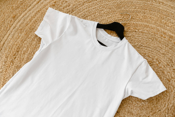 Plain white cotton t-shirt on hanger for your design - Foto, immagini