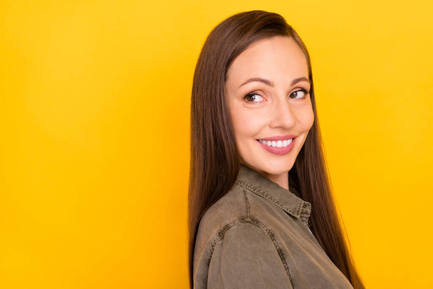Photo of dreamy cheerful charming young woman smile look empty space enjoy isolated on yellow color background - Фото, зображення