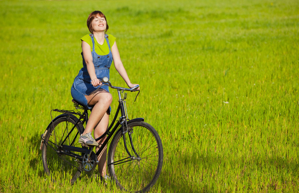 Girl with a bicycle - Foto, Imagen