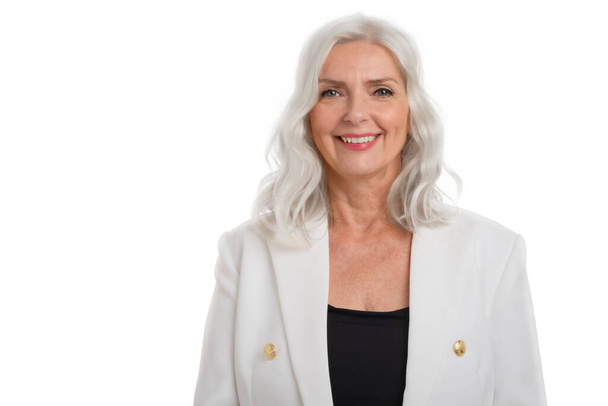 Studio portrait smiling grey haired senior woman standing at isolated white background. Copy space.  - Foto, Imagem
