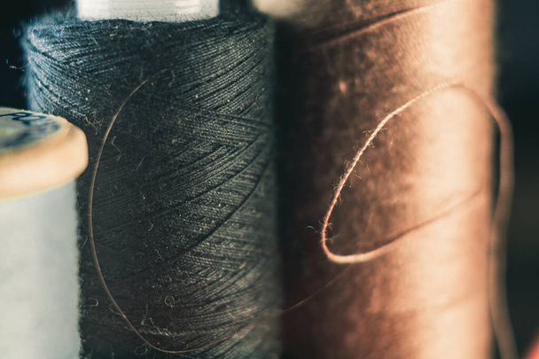 A selective focus shot of spools of thread - Photo, Image