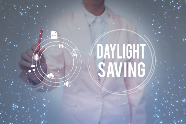 Inspiration showing sign Daylight Saving. Business overview turning the clock ahead as warmer weather approaches Lady In Uniform Holding Tablet In Hand Virtually Typing Futuristic Tech. - Photo, Image