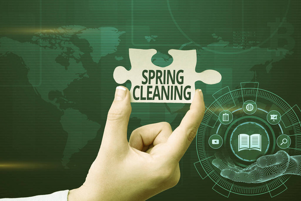 Text caption presenting Spring Cleaning. Business approach thorough cleaning of a house or room during spring Hand Holding Jigsaw Puzzle Piece Unlocking New Futuristic Technologies. - Photo, Image