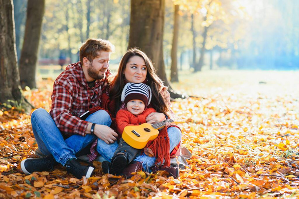 happy family mother father and baby on autumn walk in the park - Foto, Imagen