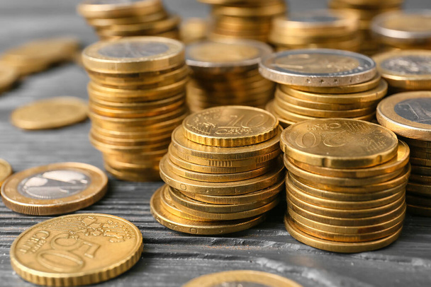 Golden coins on grey wooden background - Foto, imagen