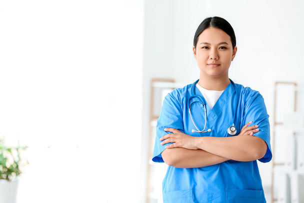 Portrait of female Asian doctor in clinic - Photo, Image