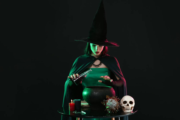 Witch performing ritual on black background - Fotografie, Obrázek