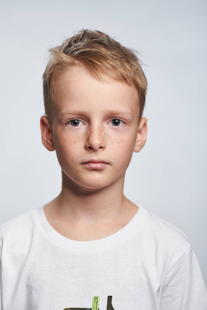Boy blond 10 years old photo for document on white background - Foto, immagini