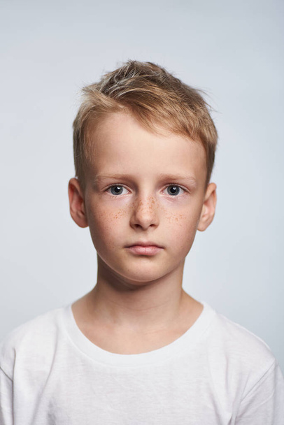 Boy blond 10 years old photo for document on white background - Foto, afbeelding