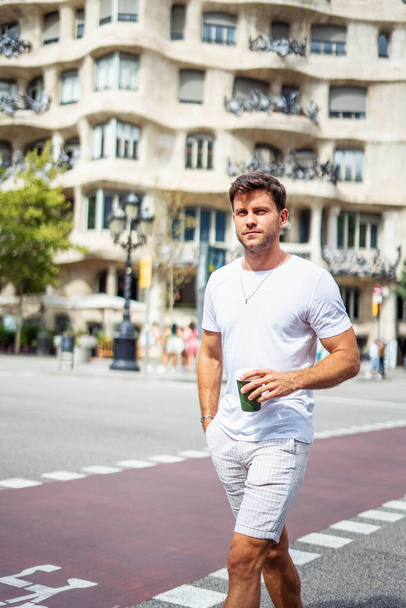 Stylish man with takeaway coffee in city - Photo, image
