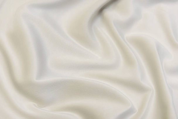 Close-up textuur van natuurlijke beige stof of doek in bruine kleur. Stofstructuur van natuurlijk katoen of linnen textiel. Beige canvas achtergrond. - Foto, afbeelding