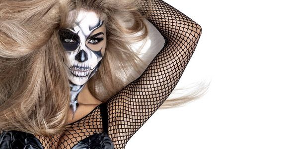 Female in Halloween silence. Sexy woman in top hat and skull make up. Halloween makeup. - Foto, imagen
