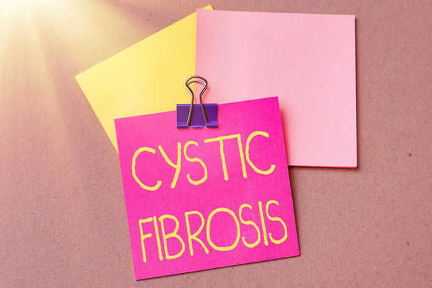 Hand writing sign Cystic Fibrosis. Business showcase a hereditary disorder affecting the exocrine glands Multiple Assorted Collection Office Stationery Photo Placed Over Table - Photo, Image