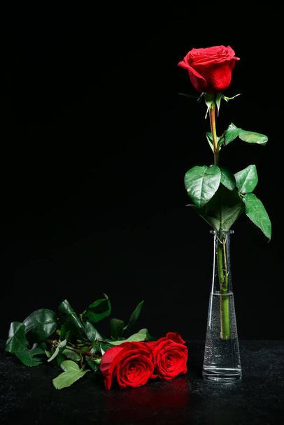Vase with beautiful rose on dark table - Photo, Image