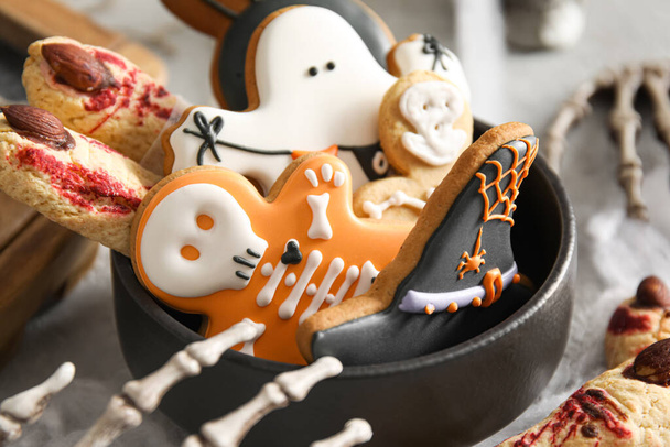 Bowl with tasty cookies for Halloween celebration on table - Photo, Image