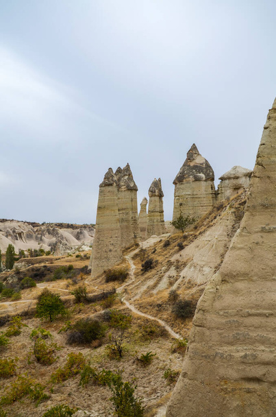 Unique famous limestone rock formations fairy chimney in the Love Valley in Cappadocia, Turkey - Foto, Bild
