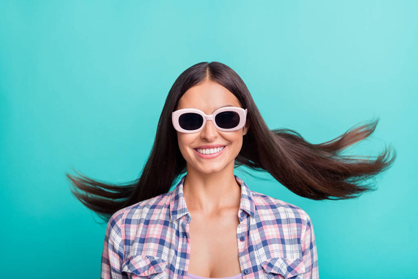 Photo of sweet millennial brunette lady wear eyewear violet shirt isolated on aquamarine color background - Foto, immagini