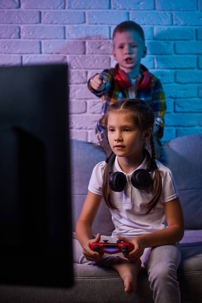 children playing video game with game console - Fotó, kép