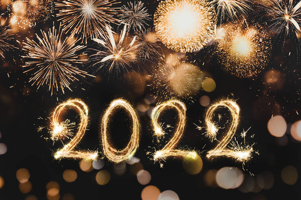 Happy New Year greeting card design. 2022 silhouettes made of fireworks  - Valokuva, kuva
