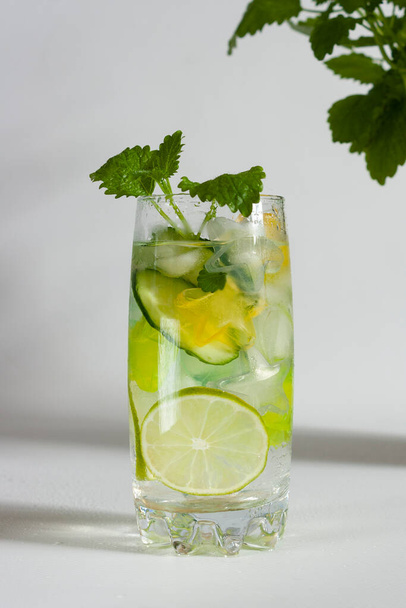 glass of lemonade with mint on grey background  - Фото, изображение
