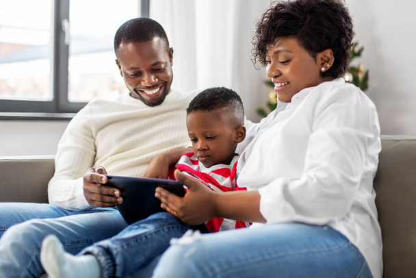 african family with tablet pc on christmas - Foto, Bild