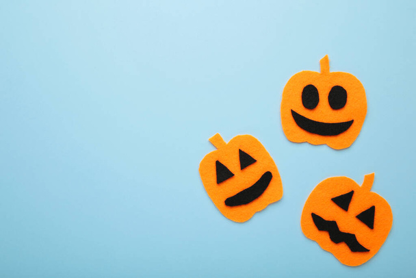 Halloween composition with pumpkins on blue background. Top view - Photo, Image
