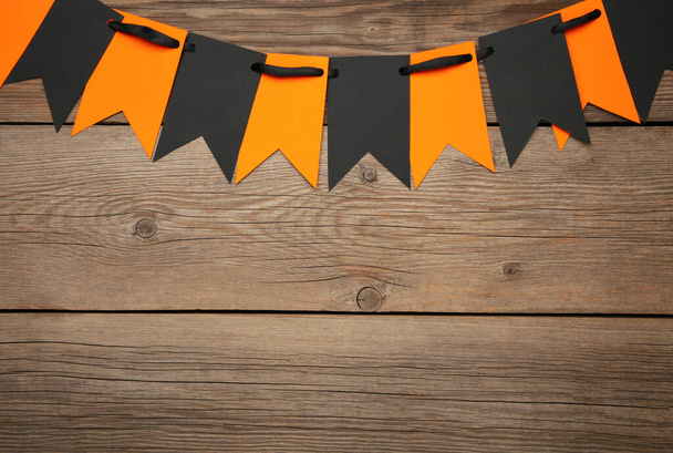 Blank and orange party flags for Halloween decoration on grey background. Top view - Foto, afbeelding