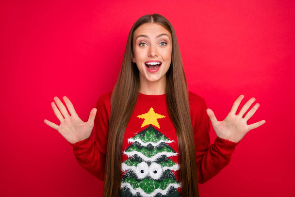 Photo of excited crazy amazed lady wow x-mas sale reaction wear ugly pullover isolated red color background - Foto, Imagen