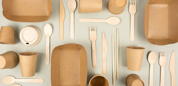 Banner of eco craft containers, bamboo cutlery and takeaway paper cups on gray background. Flat lay eco-friendly disposable picnic meals. Wooden forks and spoons. Zero waste concept. Labor Day - Photo, Image