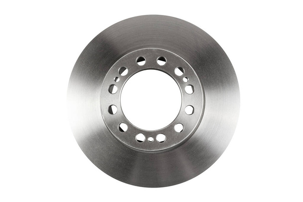 The front brake disc of a passenger car's top view is isolated on white background. A spare part for a passenger car. Part of the braking system of a vehicle. The main element of the disc brake system. - Photo, Image