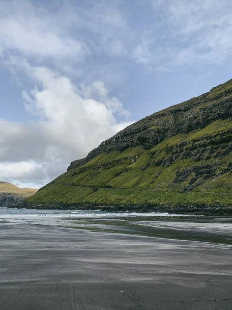 Black sand beach in Tjornuvik, Faroe Islands. Scandinavian landscape - 写真・画像