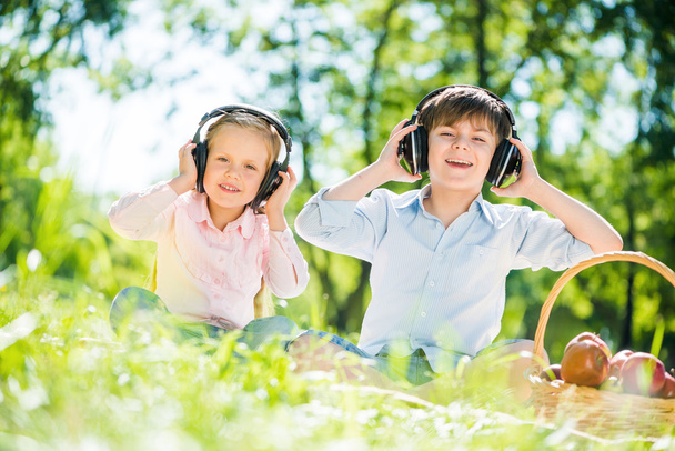 Children enjoying music - Фото, зображення