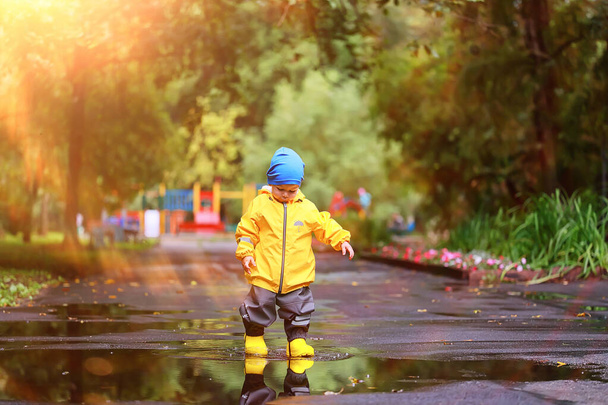 fun walk child raincoat, autumn seasonal waterproof outdoor walk - Фото, изображение