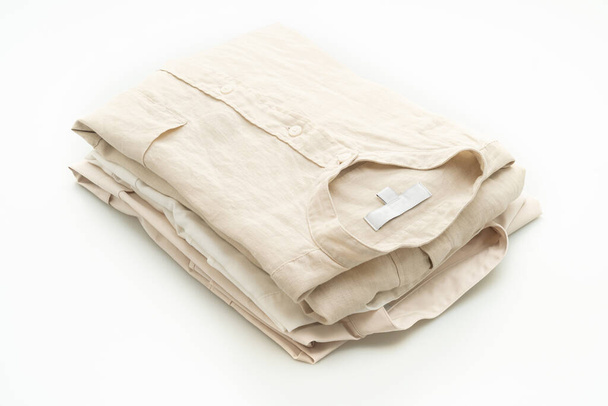 beige shirt fold isolated on white background - Fotó, kép