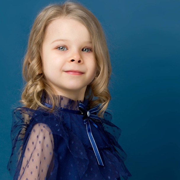 Portrait charming little girl in nice blue dress - Photo, image