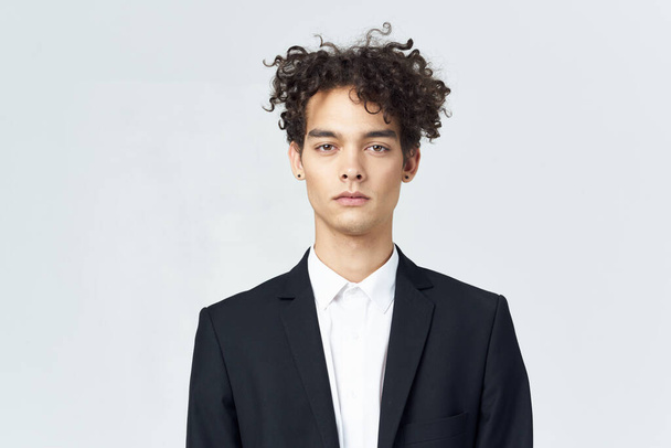 business man with curly hair in suit black blazer studio - Photo, Image