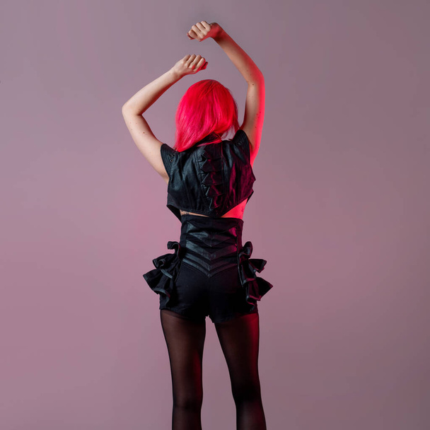Goth sexy look. young attractive woman with pink hair - Fotografie, Obrázek