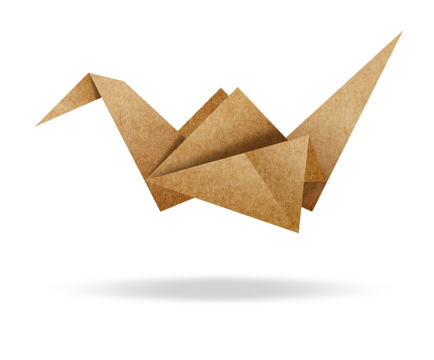 Origami Bird from Brown paper cardboard on white background  - 写真・画像