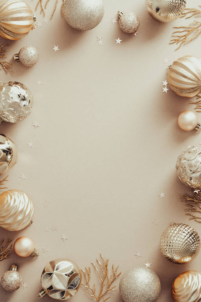 Frame with modern Christmas decorations on beige background. Elegant Christmas vertical banner design, New Year poster mockup. - Fotografie, Obrázek