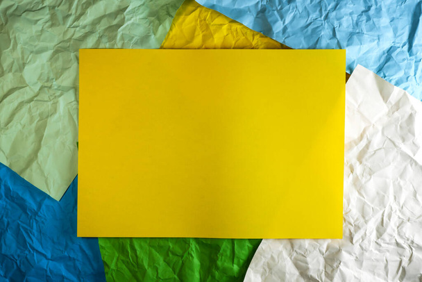 Colored paper background with yellow rectangular place for text in the center - 写真・画像