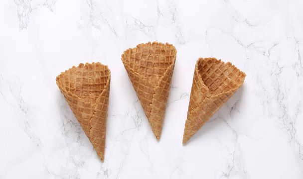 Empty waffle cones on marble background - Photo, Image