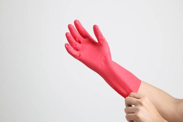 The pink gloves on the white background. - Фото, зображення