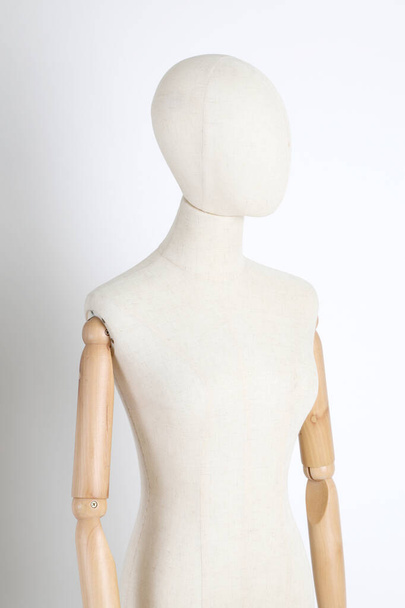 The fablic mannequin standing on the white background. - Фото, зображення