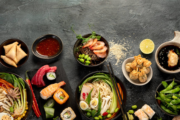 Japanese dishes and snacks on gray background. Traditional food concept. Top view, flat lay, copy space - Fotografie, Obrázek