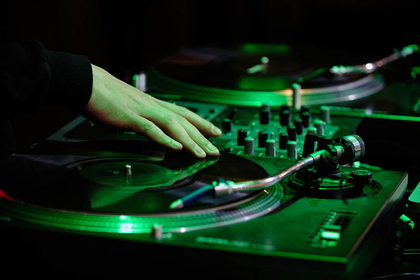 Dj playing music with a mixer - Photo, Image