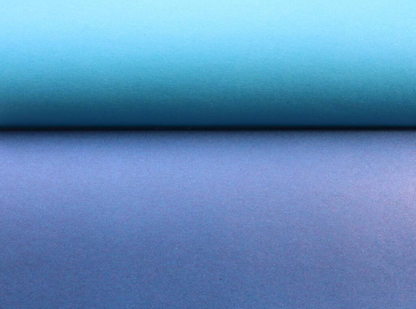 blue-gray graphic resource bisected by a shaded line, paper texture of two sheets tucked in a wave, two-tone paper background of cold shades, blank backdrop of even colored material - 写真・画像