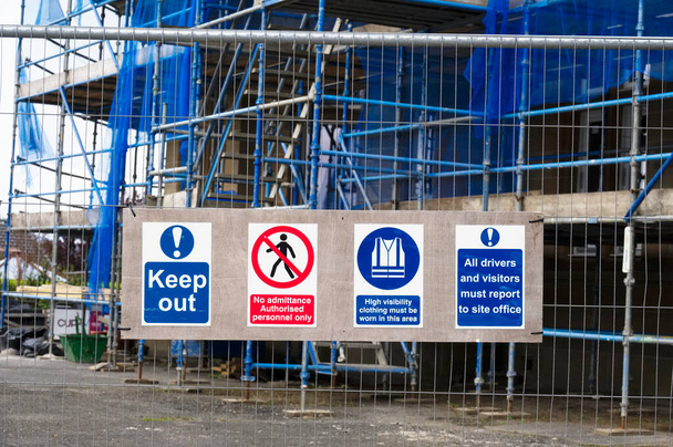 Construction site health and safety message rules sign board signage on fence boundary - Photo, Image