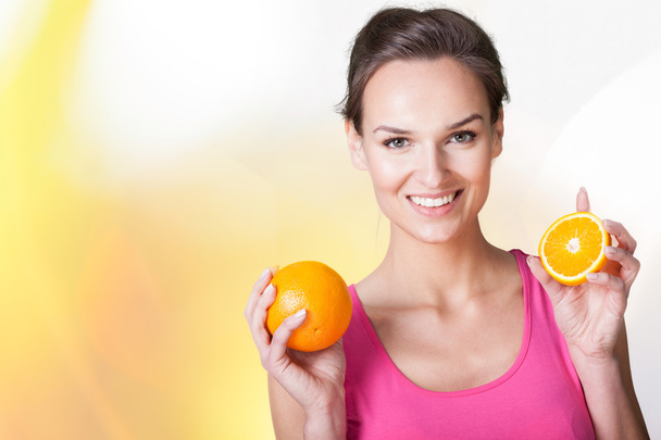 Happy woman with oranges - Photo, Image